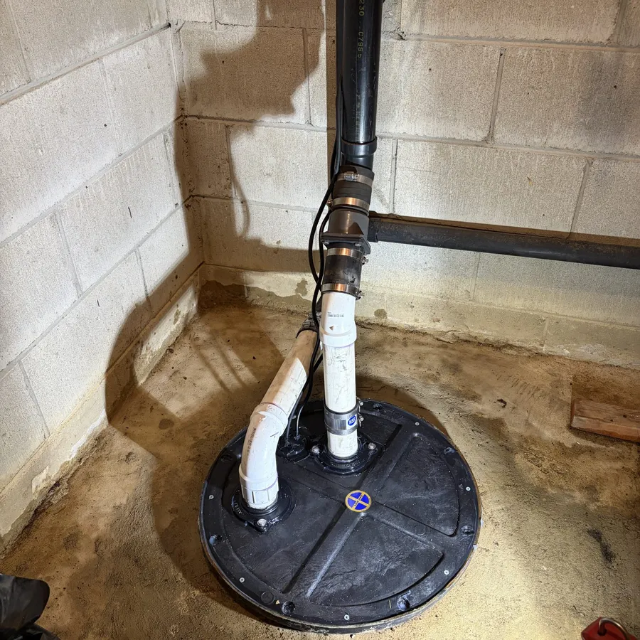 Ejector pit and sump pump service in a basement