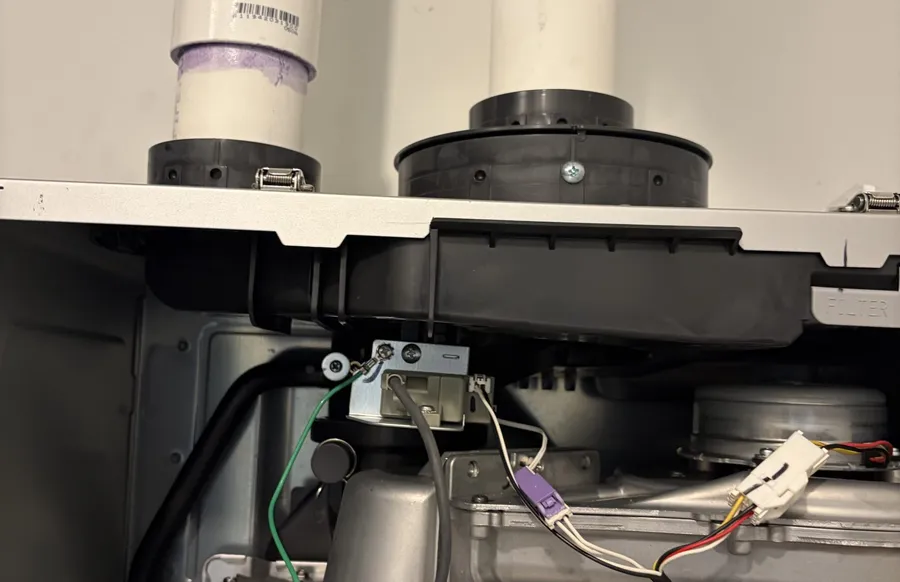 Tankless water heater unit serviced from below
